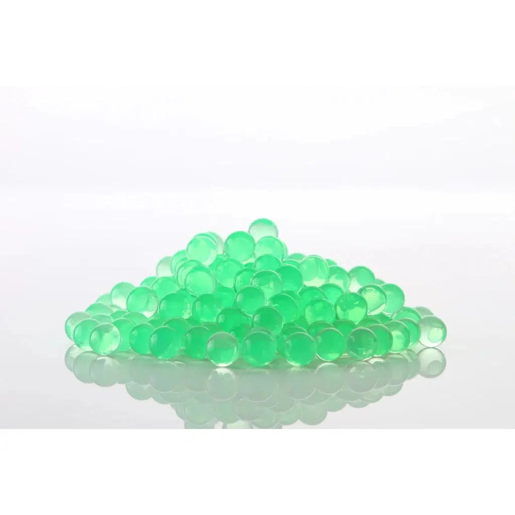 A pile of gellets (water expanding squishy orbs). They are electric green.