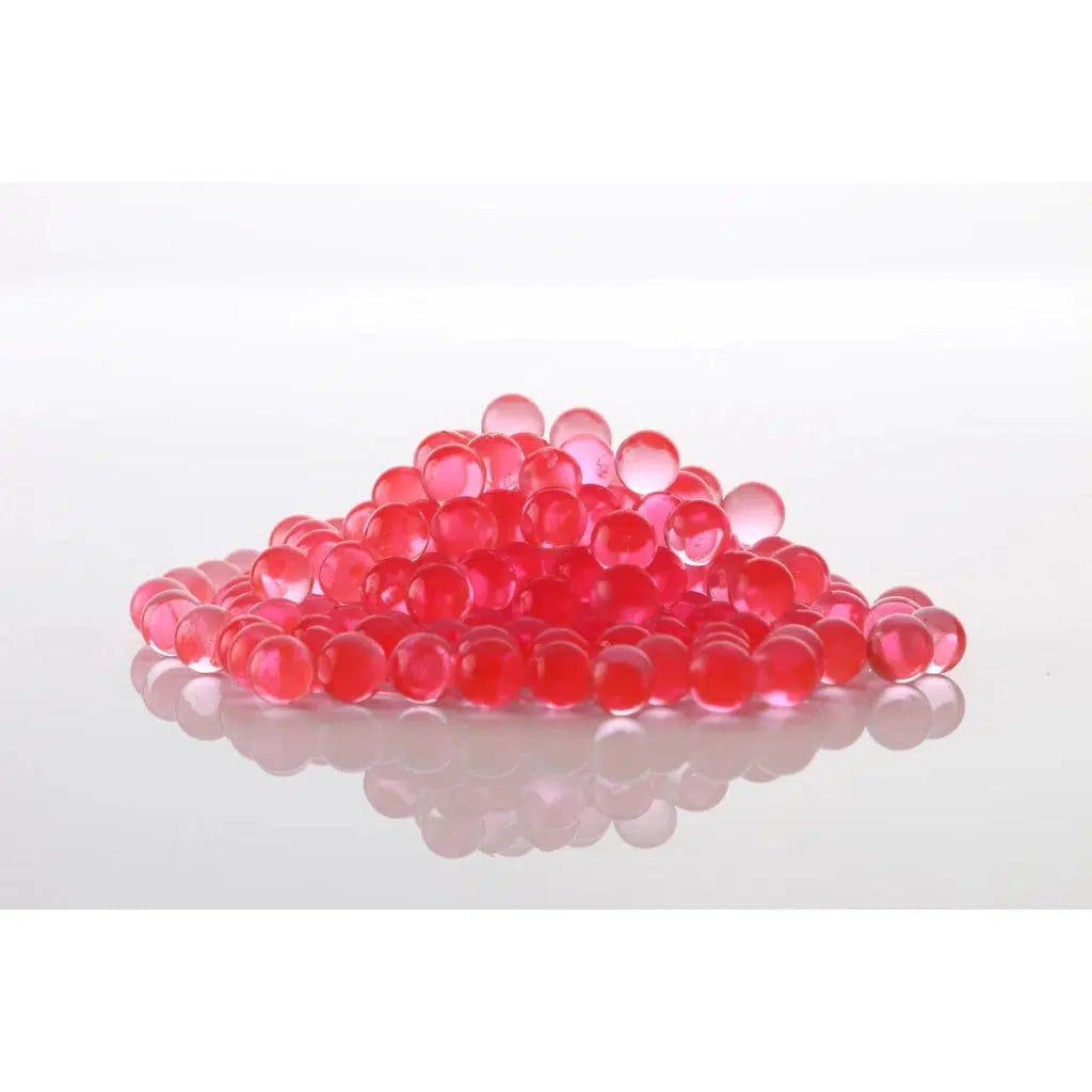A pile of red gellets (water expanding squishy orbs)