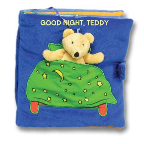 Image of the cover for the book Goodnight Teddy. On the front is a picture of a bed with a slit in it so a small stuffed teddy can sit inside.