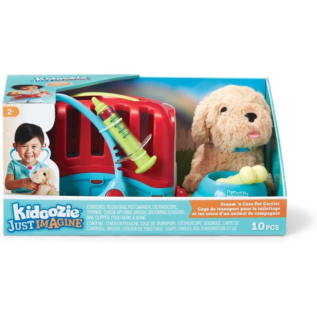 The box set of the Groom 'n care pet carrier. the puppy and the dog carrier are most visible in the set, and an image of a kid holding a stethoscope to the dog is on the box
