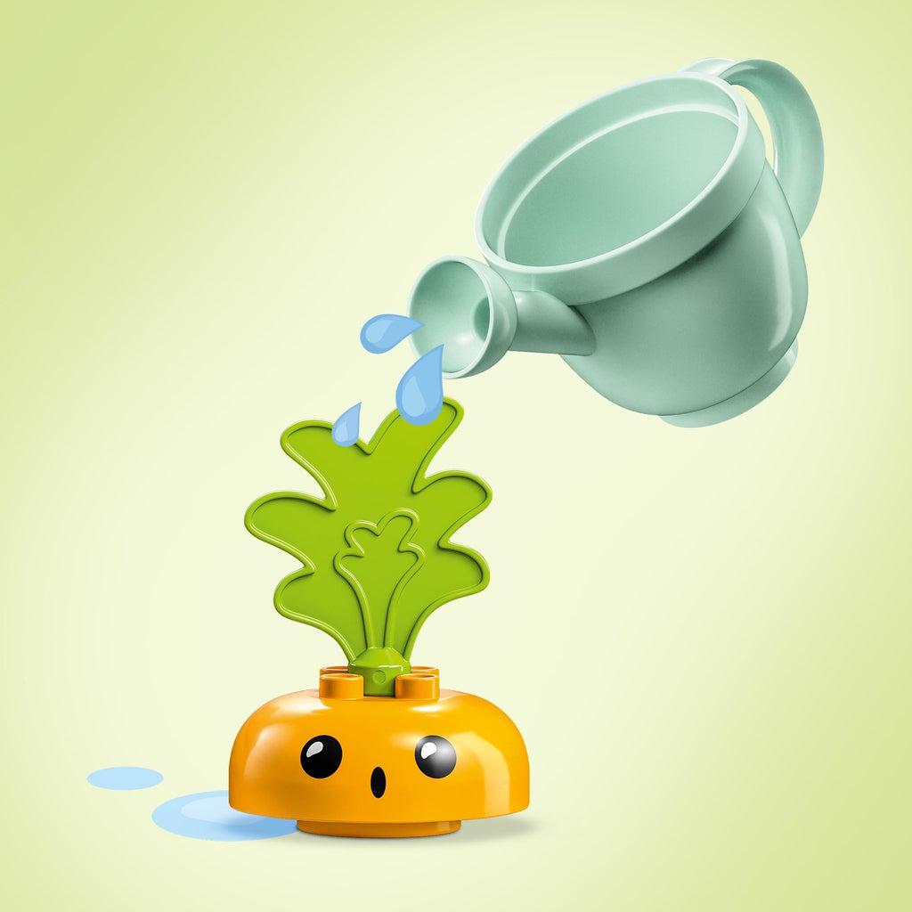 Image showing that you can "water" the carrot plant with the included LEGO watering can.
