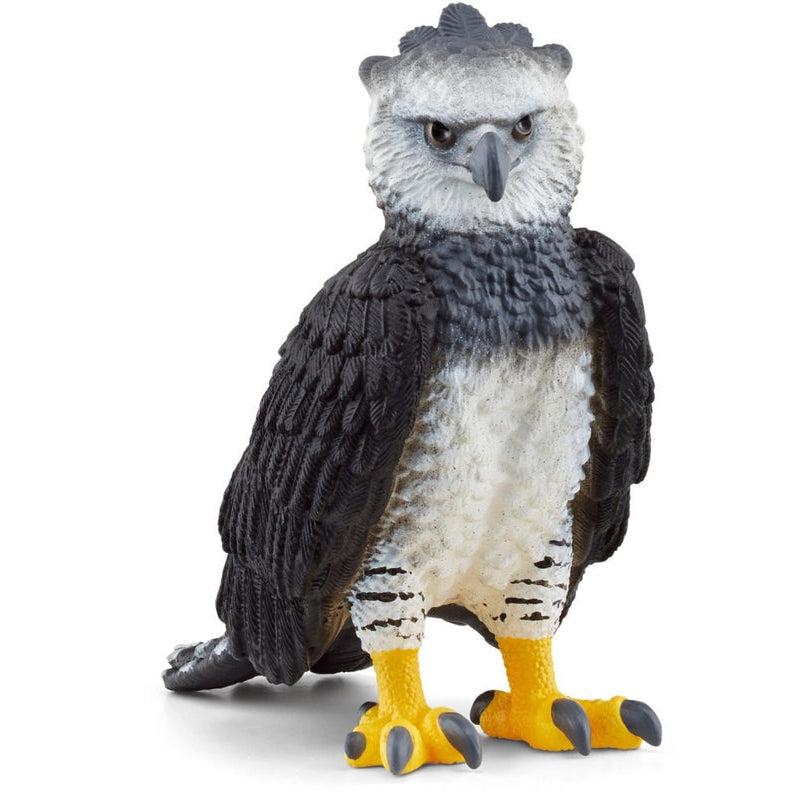 Image of the Harpy figurine. It is a scary looking bird with a range of feathers colored white to black. It has a sharp beak and large yellow clawed feet.