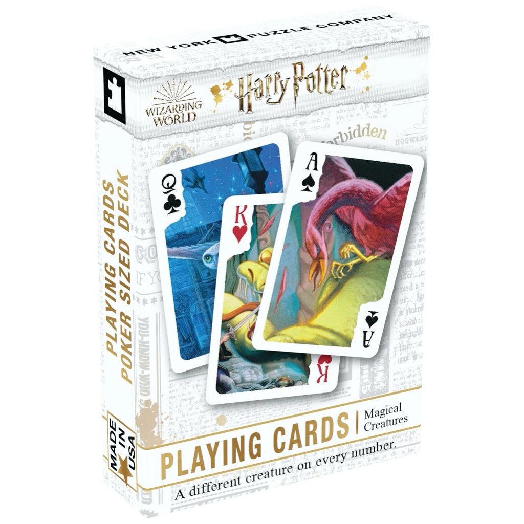 Image of the box for the Harry Potter Magical Creatures playing card deck. On the front is a picture of three cards that have pictures of different magical creatures from the Wizarding World on them. It shows that there is a different creature on every number.