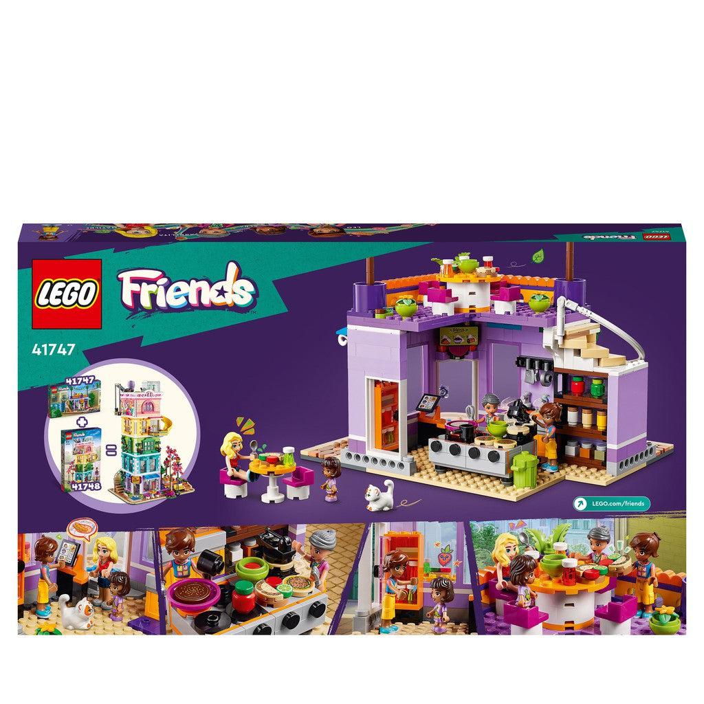 image shows the back of the box with the kitchen open for buisness! move the LEGO friends characters around to run the kitchen
