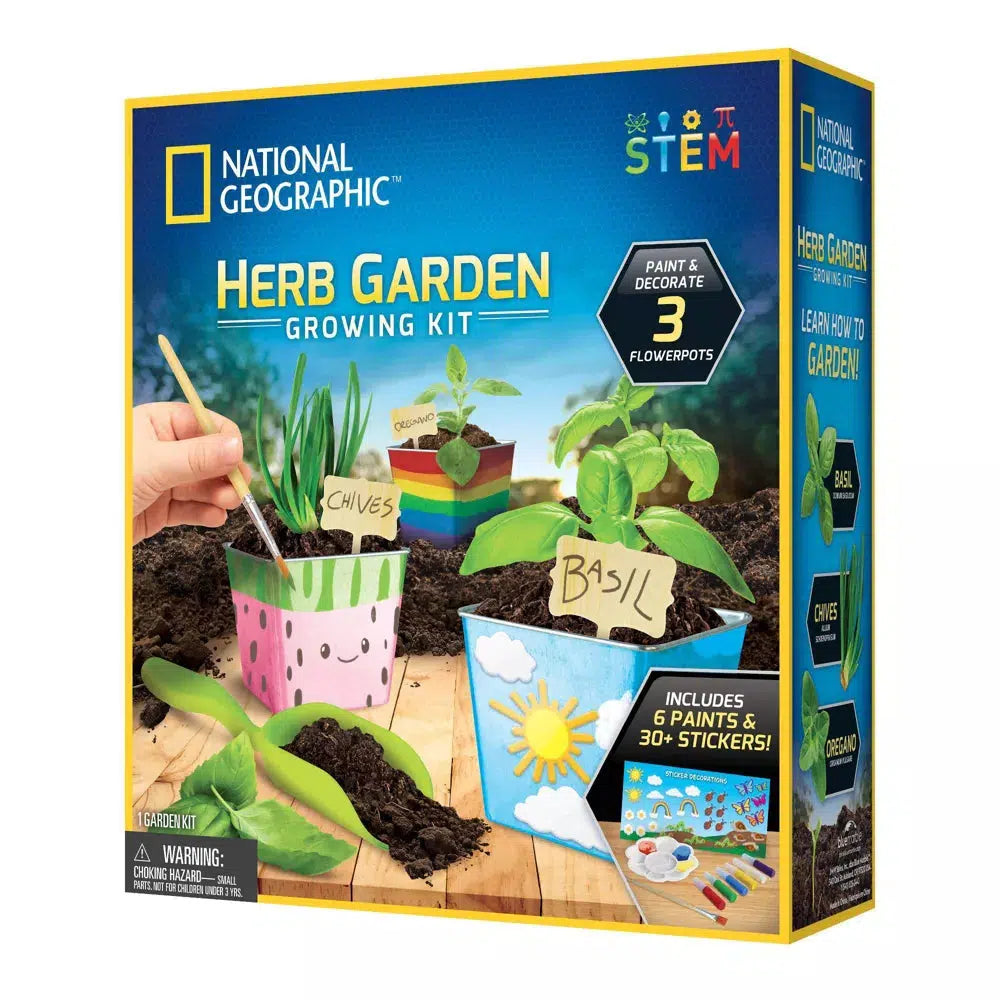 This image depicts the box for the national geographic herb garden growing kit. a hexagon sign says "Paint and decorate 3 flowerpots" at the bottom a picture of a sticker pad says "includes 6 paints & 30+ stickers. 