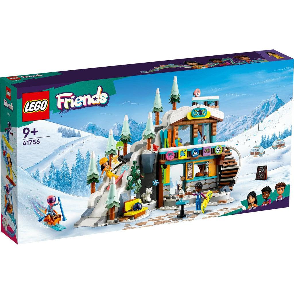 Image shows the LEGO friends Holidy ski slope. there are trees on top of a building that has a slope going down to ski on. 