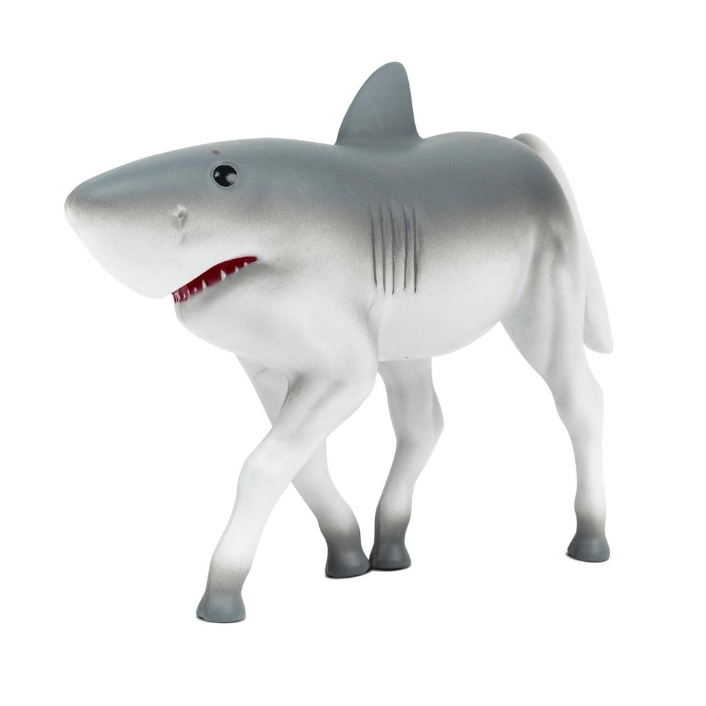 Image of the Hork Figure. it is a shark with horse legs coming out of its stomach and a horse tail in the back.