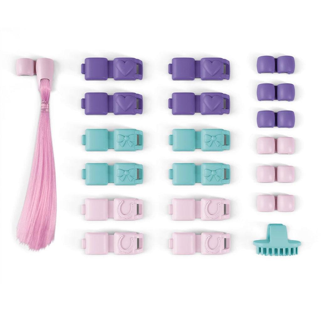 Image of the Horse Hair Accessories. It comes with multiple clips, a brush, and a pink hair extension.