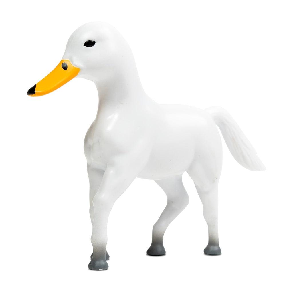 Image of the Huck Figure. It is a white horse with the head of a duck.