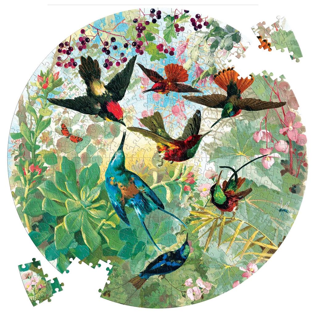 image of the puzzle almost completed ,hummingbirds are flying around green foliage and small berrries