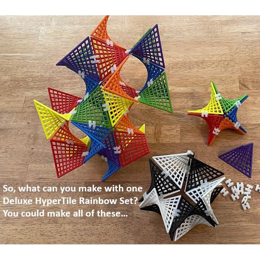 this image shows a star, and shapes that my eyes can not desctibe as they twist around in beautiful patters. text say "What can you make with one deluxe hypertile rainbow set?"
