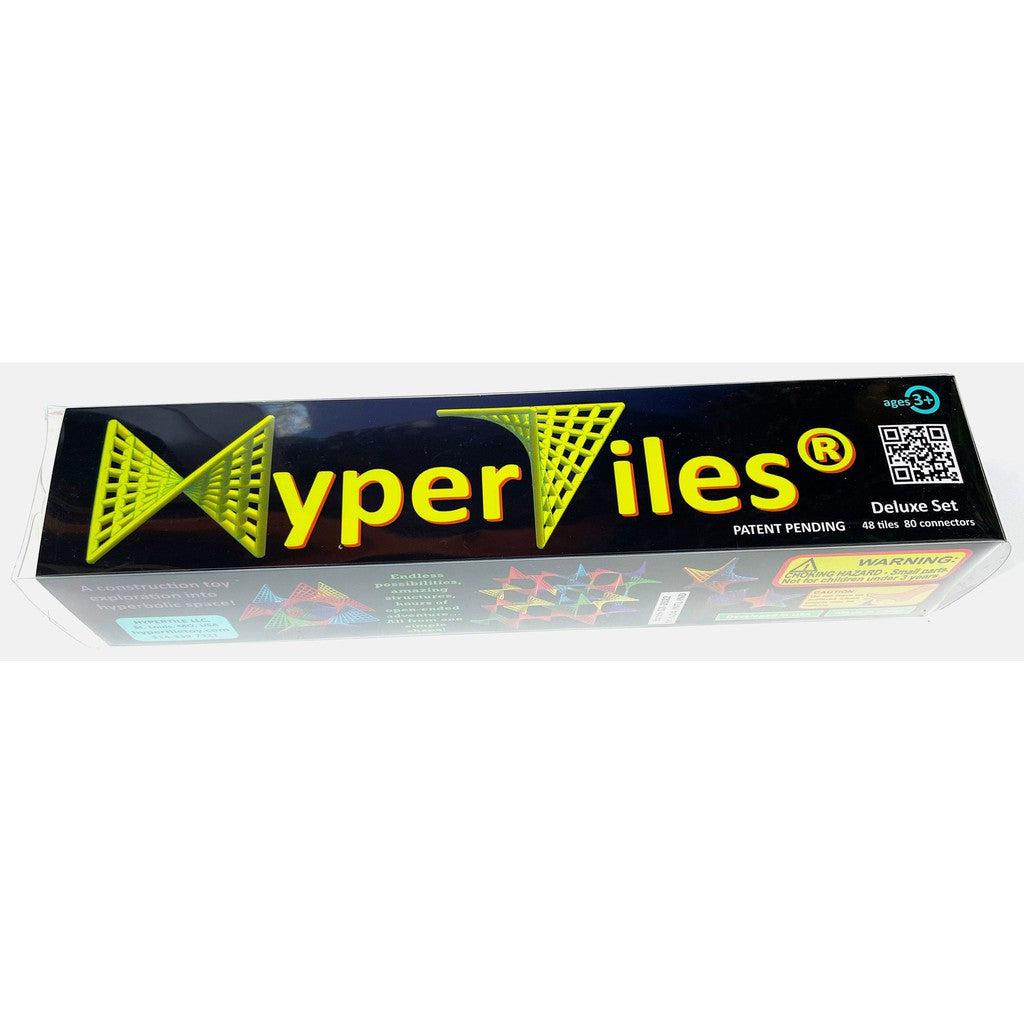 the deluxe set for hyper tiles is a long tube full of the tiles in rainbow colors.