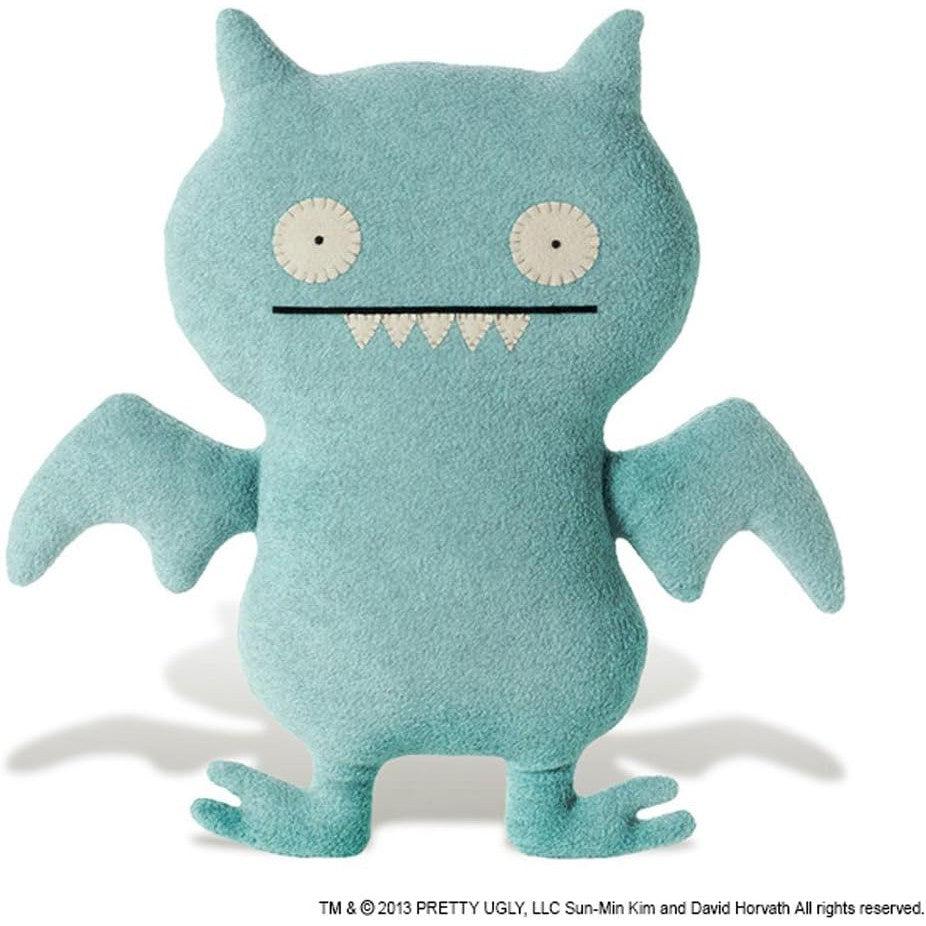 Meet the GUND Ugly Doll, a plush toy with whimsical wings and pointed ears. Its light blue body boasts round eyes and an open, jagged mouth, adding charm to its quirky design. 