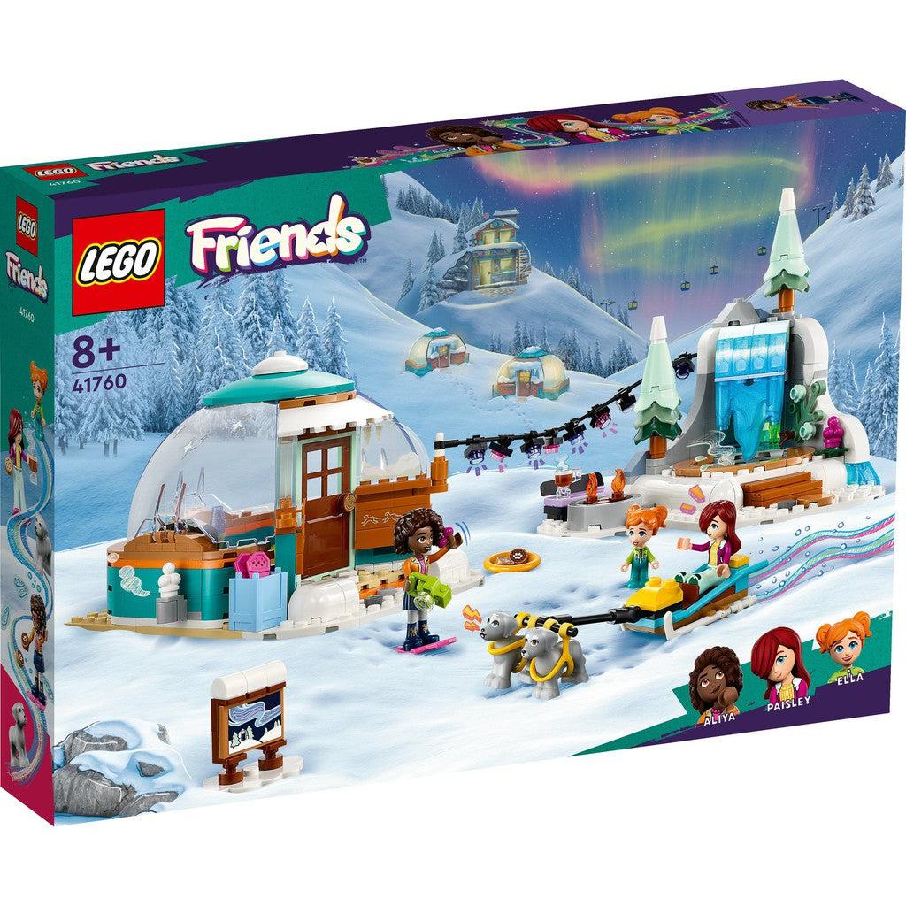 image shows the LEGO Friends igloo package. the box shows off snowy slopes to sled on with a cozy igloo in the center.