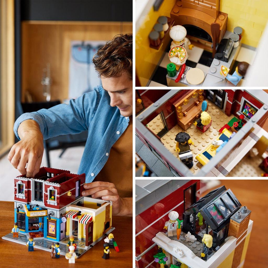 Scene of a hot man with good hair building the LEGO set carefully