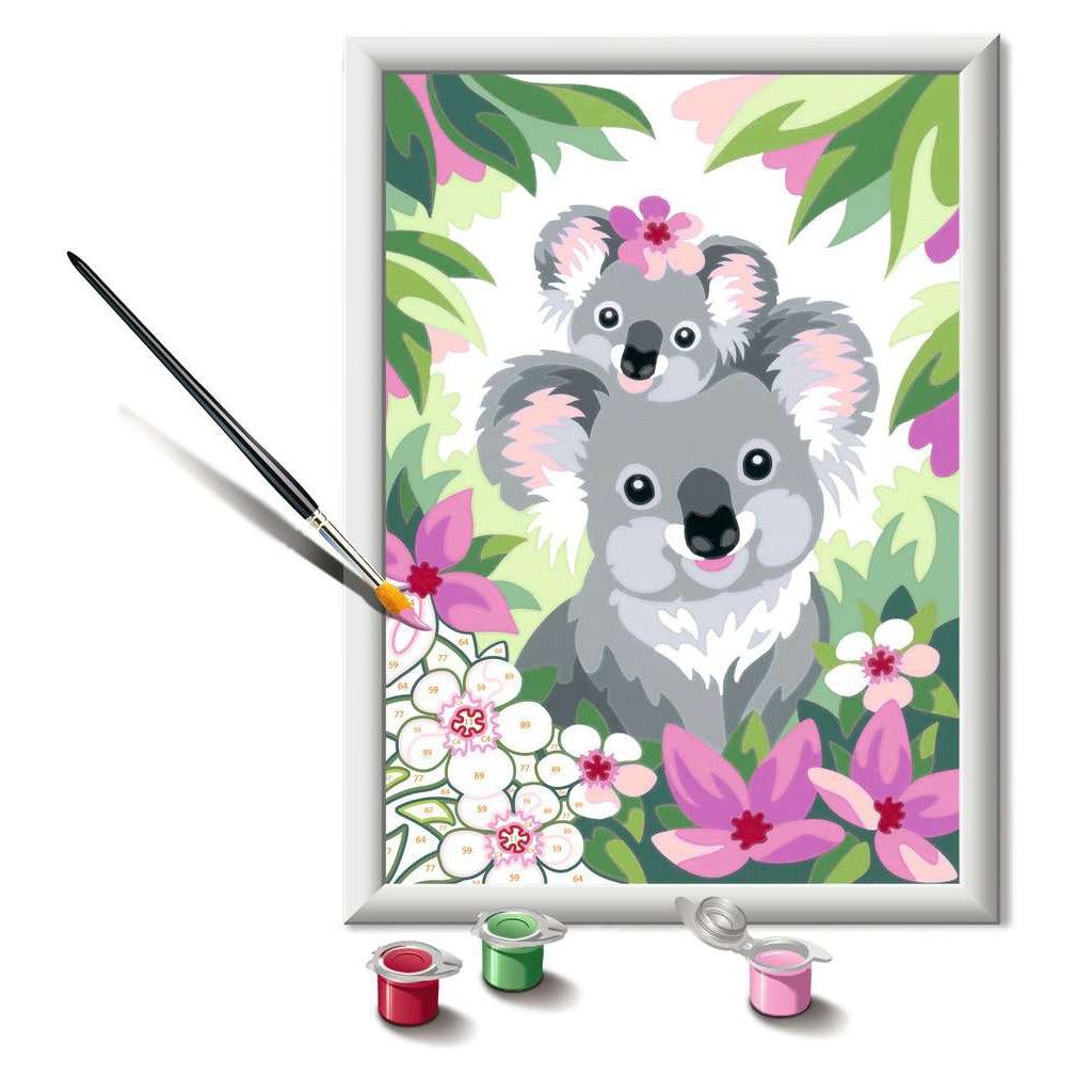 this picture shows a paint brush painting pink on the canvas to ass some slowers around the koalas. there are plenty of numbers to paint on and make a lovely image. 
