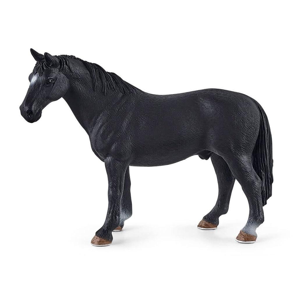 Close up of one of the horse figures. It is a completely black horse.