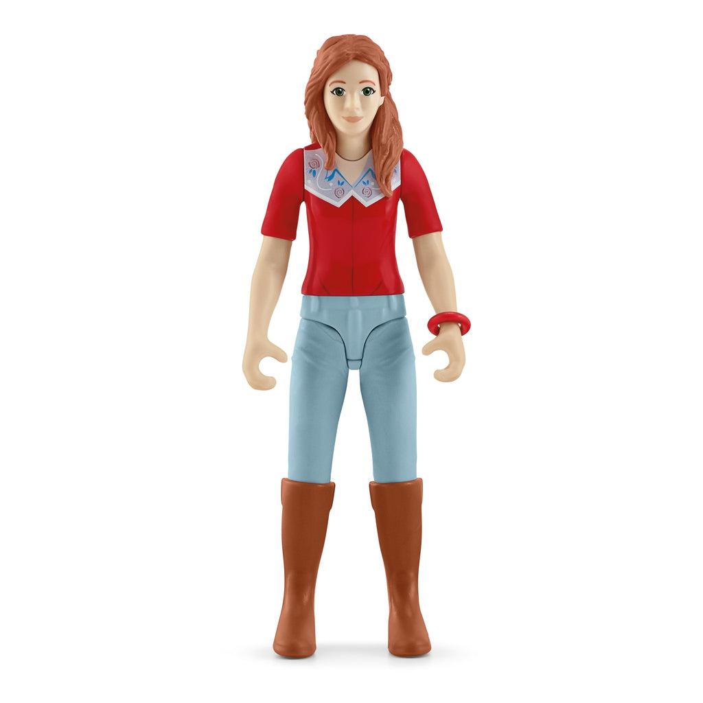 Close up of one of the figures. Shes has long red hair with a red riding shirt, light blue pants, and brown boots.