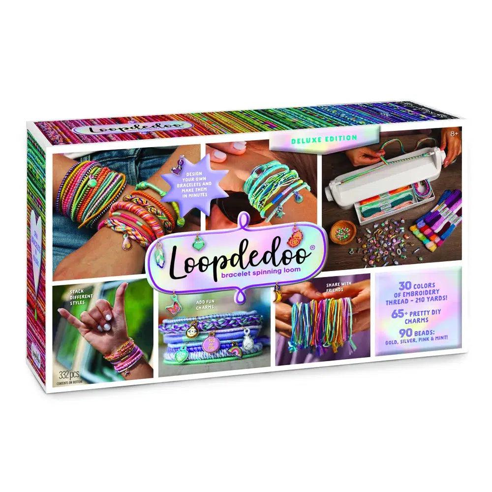 this image shows the loopdedoo bracelet spinning loom. make your own bracelets and diy craft with this .there are 30 colors of embroidery, and 210 yards of threads. 65 charms and 90 beads to make a fun bracelet. 