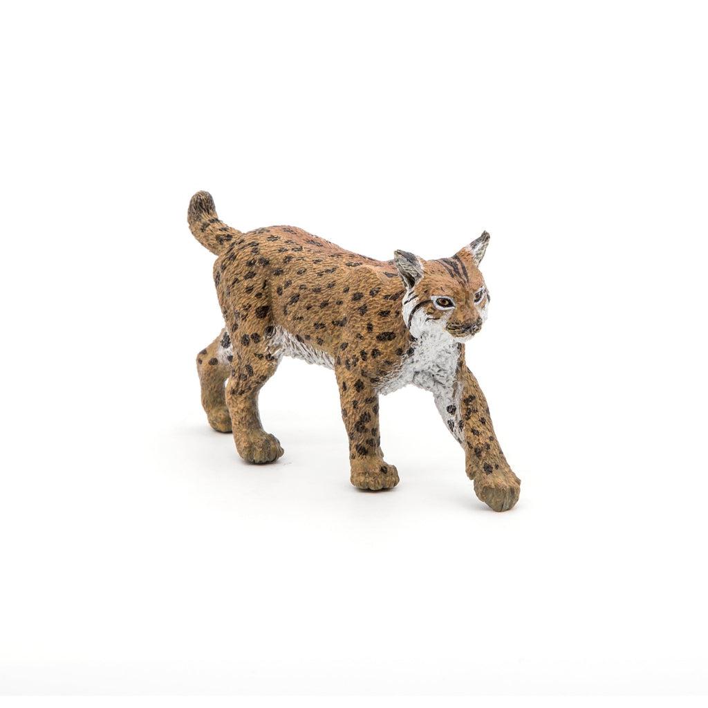 Image of the Lynx figurine. It is a brown cat with small black spots and a white belly.