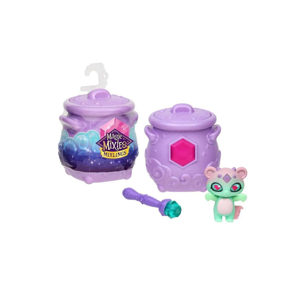 Image of all parts included in the Magic Mixies Mixlings. It comes with a cauldron, a magic wand, and a magical Mixling!