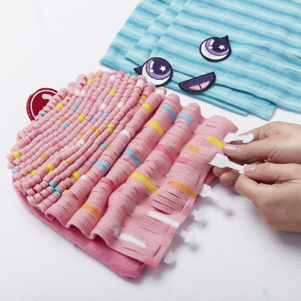 this image shows the cupcake pillow being formed with plastic tabs to help weave and scrunch the pillow up