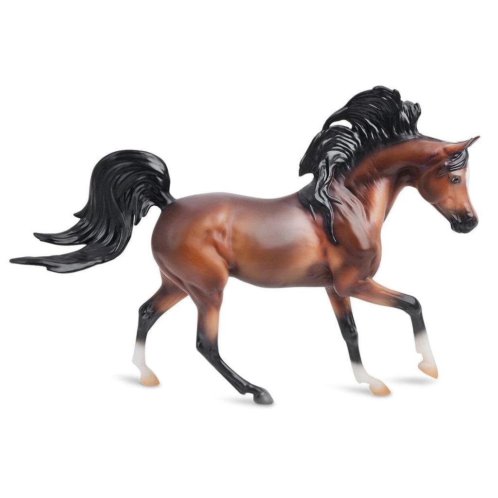 Image of the Mahogany Bay Arabian figurine. It is a red-brown horse with long flowing black mane and tail. It also has black nose and legs.