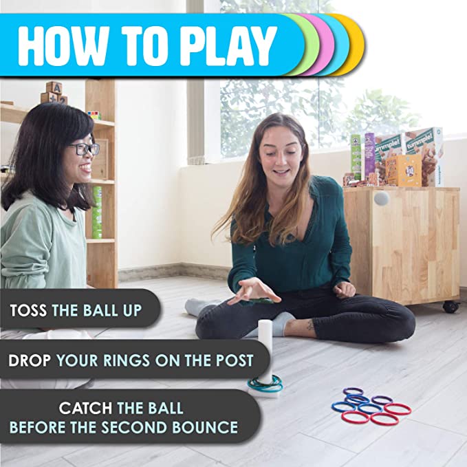 Shows you how to play. 1) toss the ball up 2) drop your rings on the post 3) catch the ball before the second bounce.