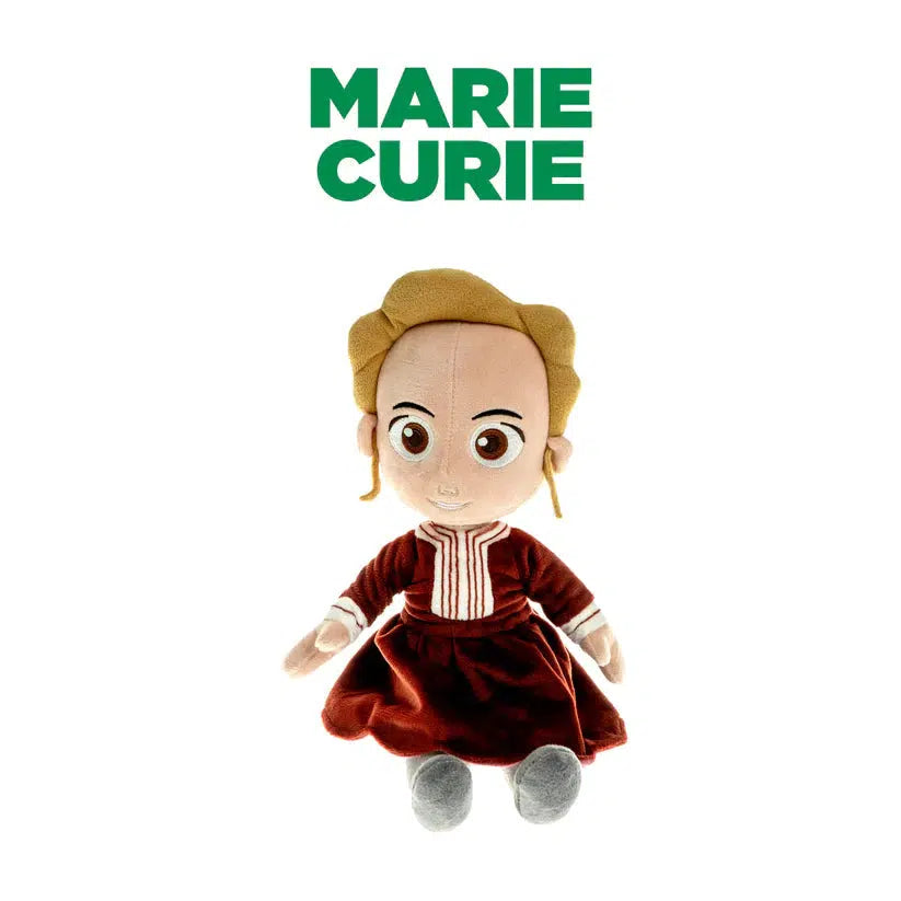 A doll of Marie Curie, a prominent historical scientist. The doll is wearing a red dress with white trim down the front and on the cuffs