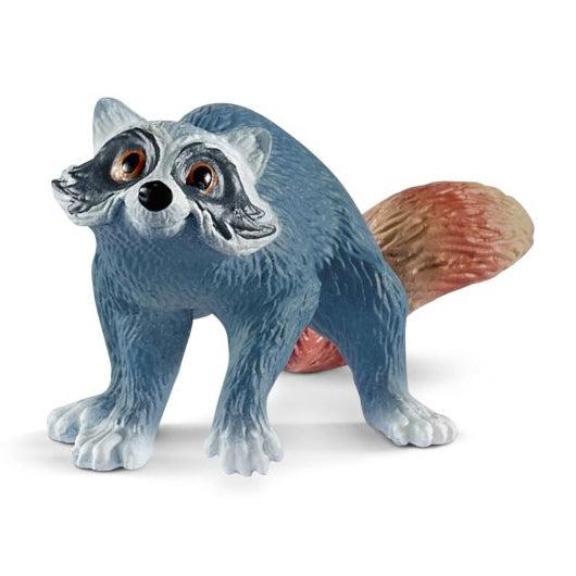 Image of the raccoon figurine. It has a blue body and a fluffy orange tail.