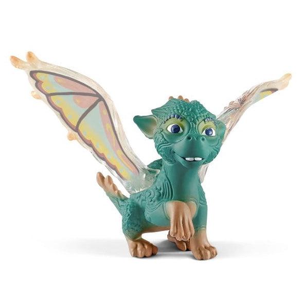 Image of the tiny dragon figurine. It has a turquoise body and rainbow fairy wings.