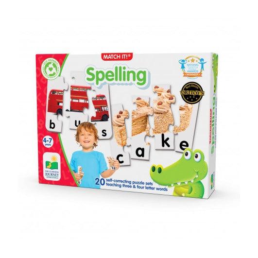 Image of the packaging for the Match It! Spelling game. On the front is a picture of some of the game pieces and a picture of a little boy holding some of them.