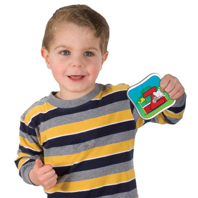 Scene of a little boy holding up the Z matching card