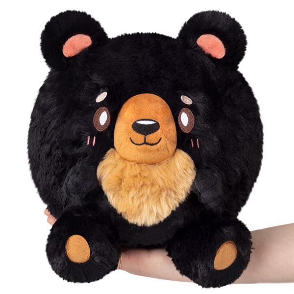 Image of the Mini Black Bear squishable. It is a black bear with a tan snout and belly.