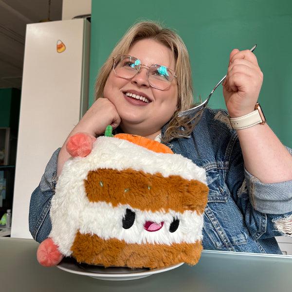 Scene of a woman pretending to eat the plush.