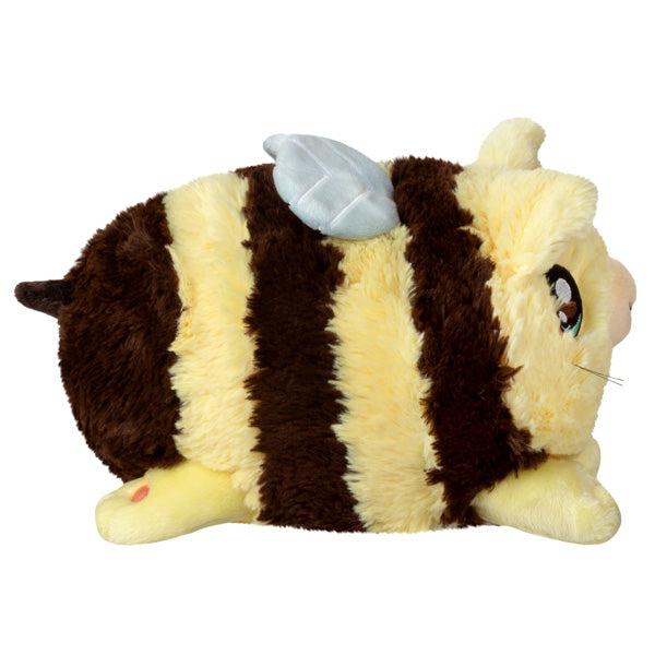 Side view of the plush. Shows that it has cat paws and a brown stinger.