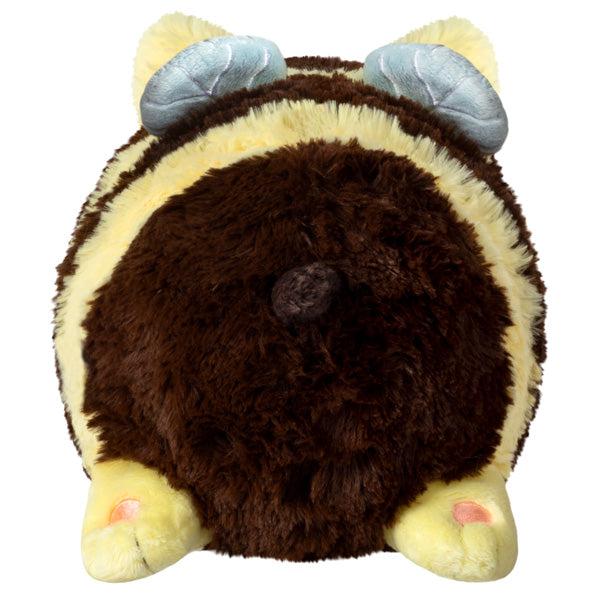 Back view of the plush. Shows that it has light grey circular wings on the top.