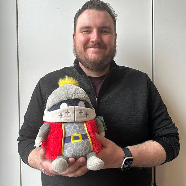 Person holding knight plush