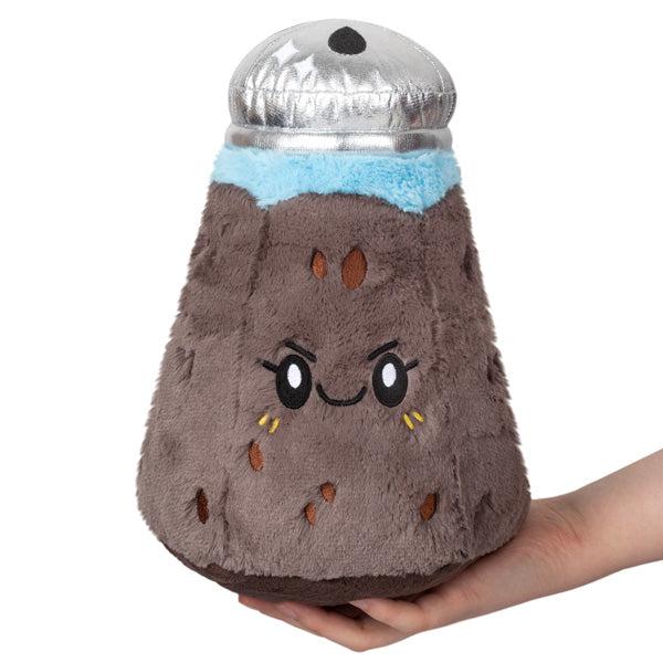 Image of the Mini Pepper squishable. It has a silver top to the shaker. It has a spicy facial expression and eyelashes.