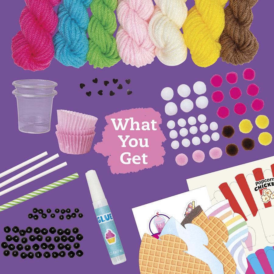 Image of all the included materials. The kit includes seven different colors of yarn, pompoms, eyes, glue, straws, and paper for creating bases for your creations.