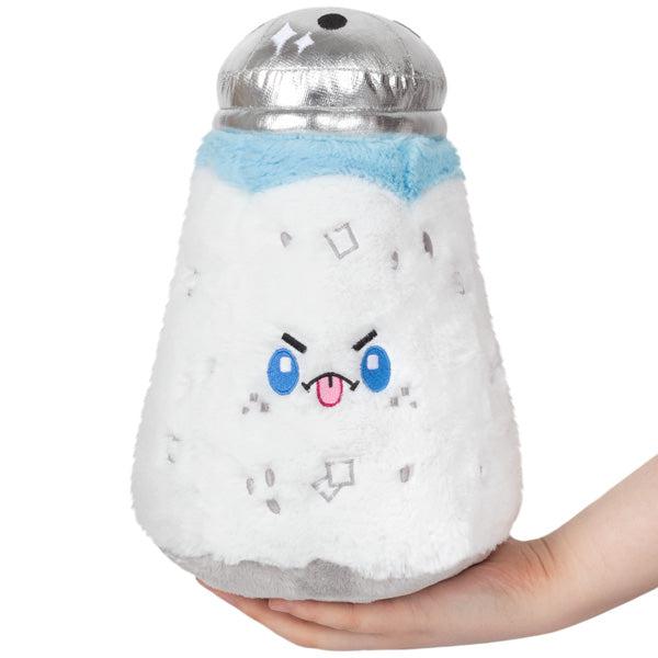 Image of the Mini Salt squishable. It has a silvery top to the shaker. It has a salty facial expression.