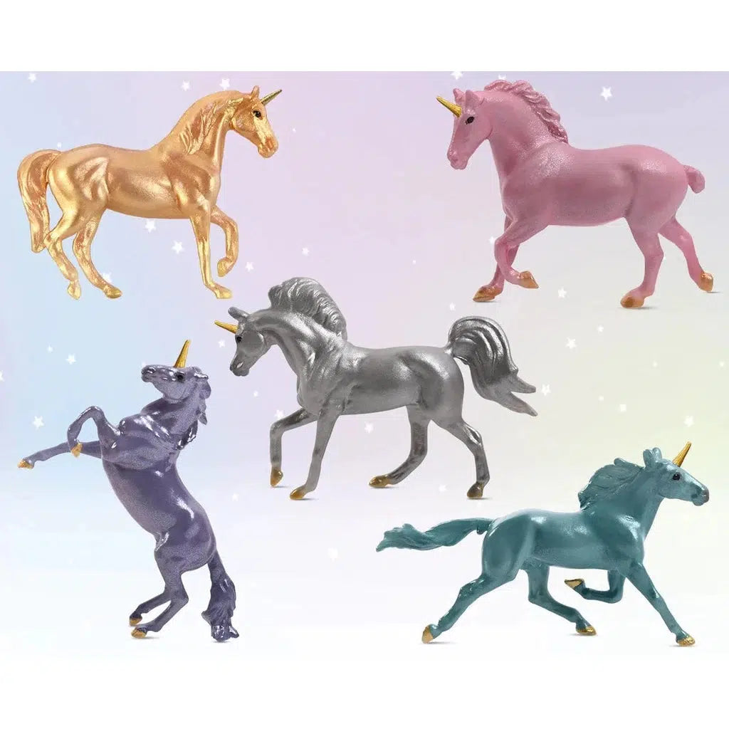 Image of the possibly included unicorn figurines. One is golden, one is pink, one is silver, one is purple, and one is teal.