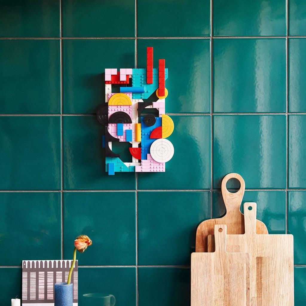 image shows the Modern Art LEGO set mounted on the wall like a painting or picture frame