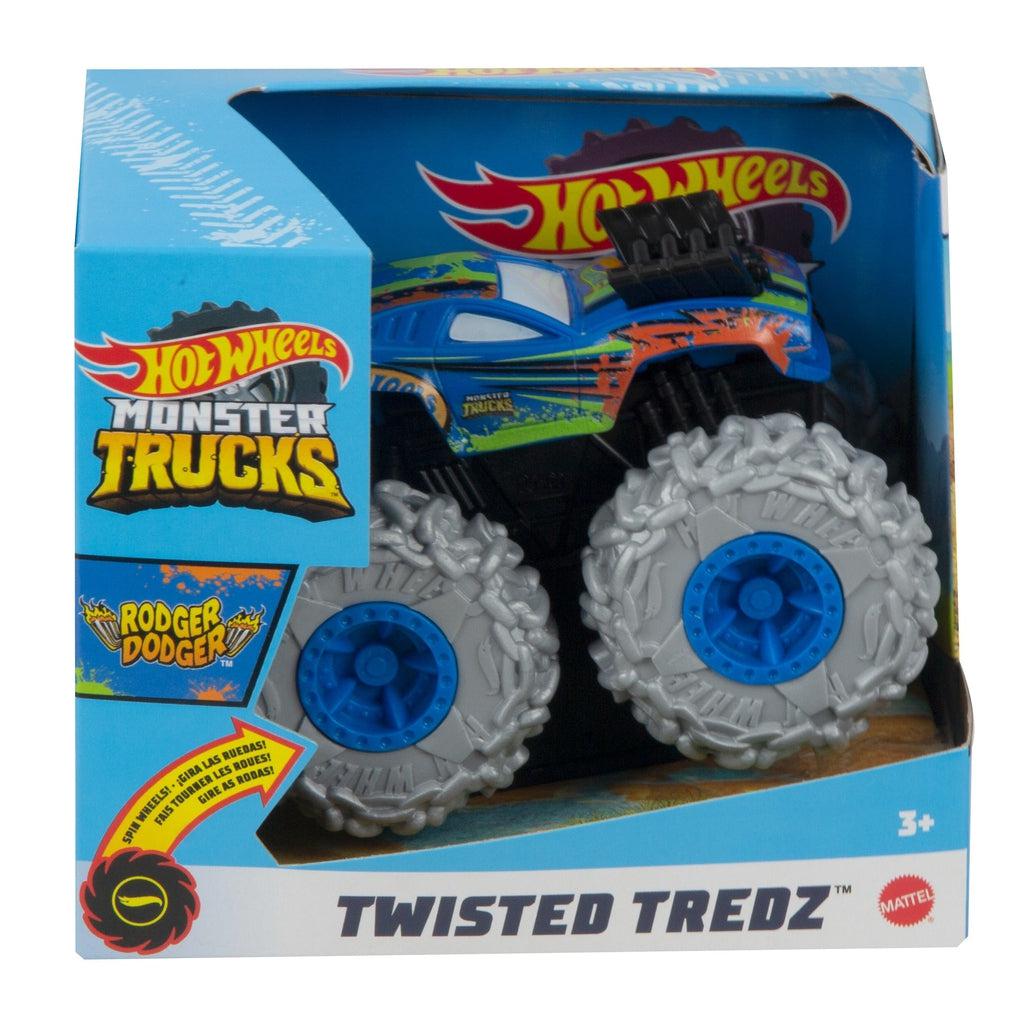Image of one of the Monster Truck Rev Tredz Hot Wheels vehicles. This one has a blue body with orange splatter paint body and large light grey chained tires.