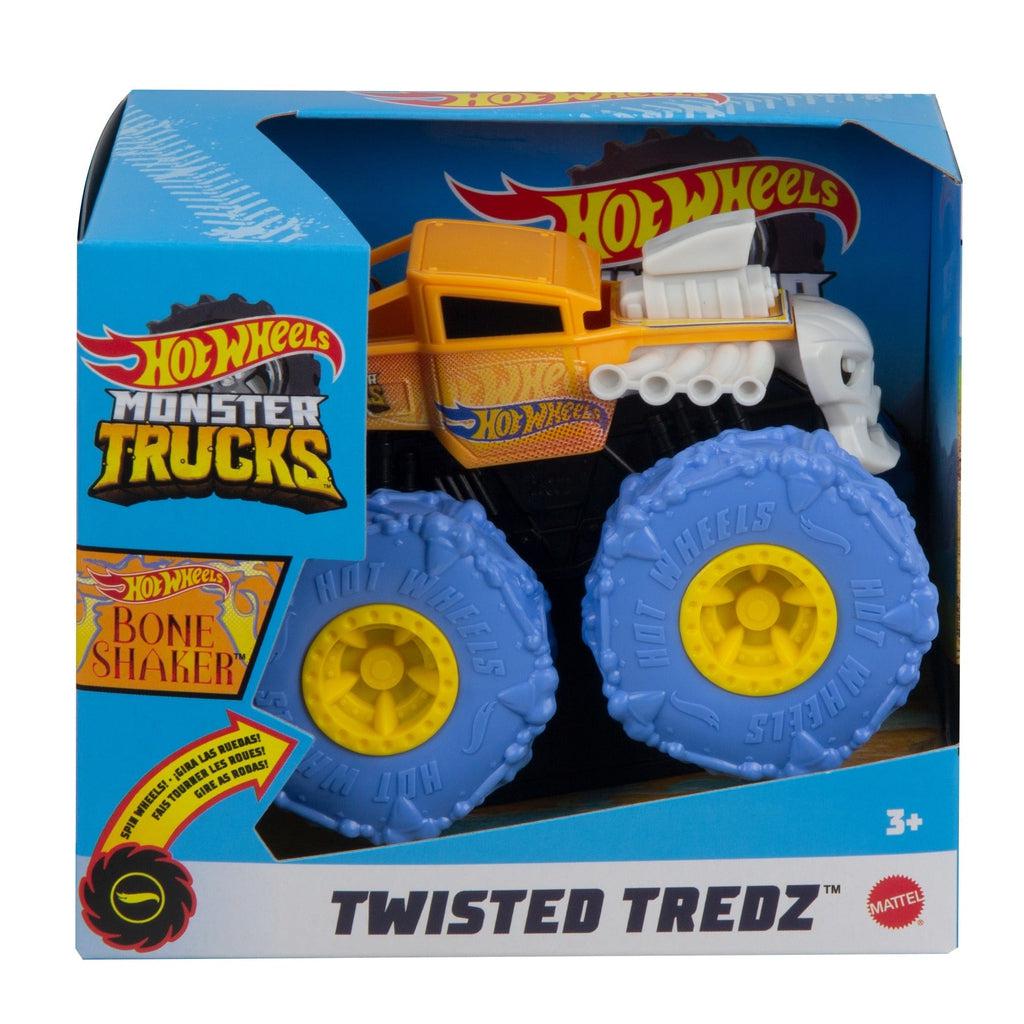 Image of one of the Monster Truck Rev Tredz Hot Wheels vehicles. This one has an orange body and large blue and yellow tires.