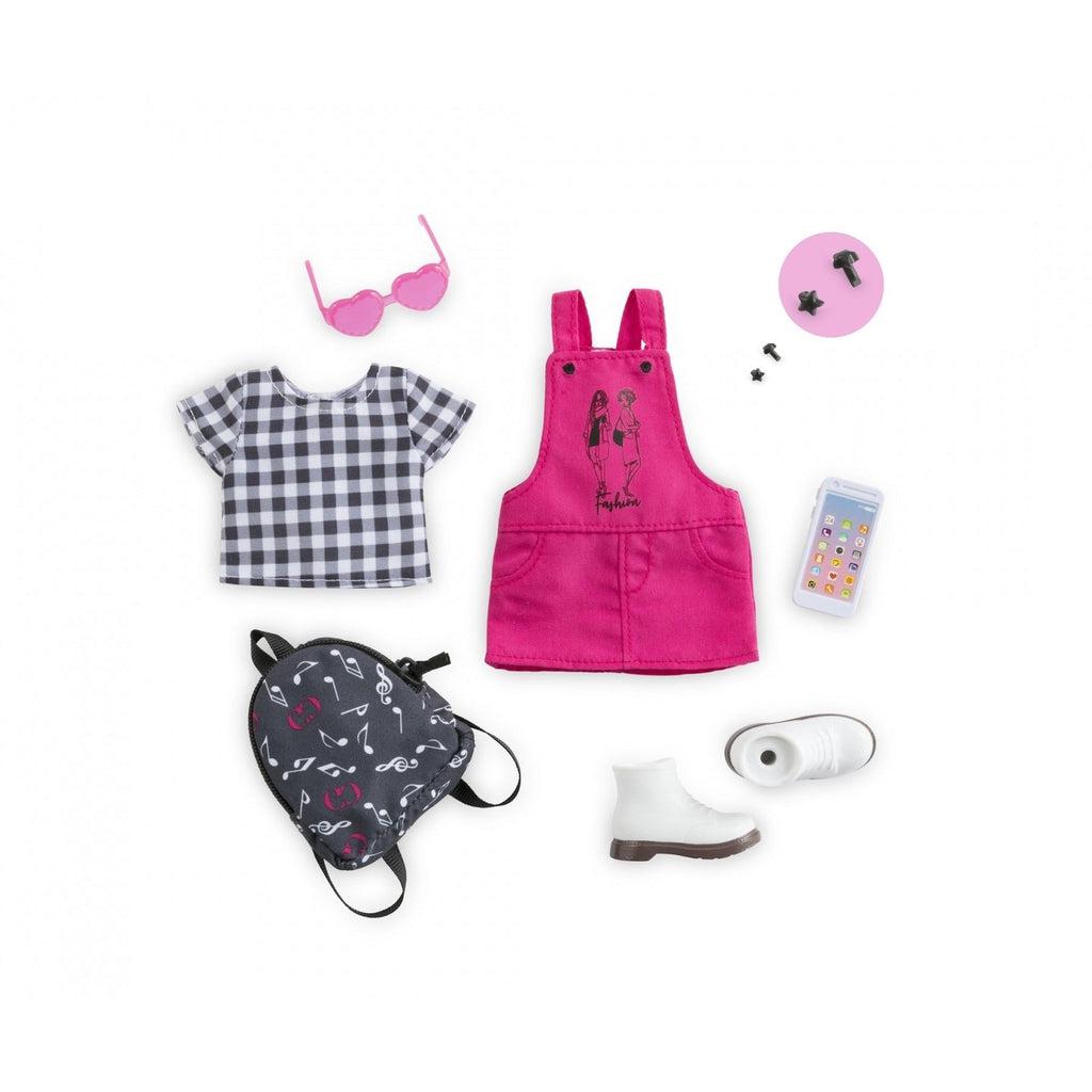 Image of all the included pieces. The set includes a pink overall skirt, a black and white checked shirt, pink heart glasses, a music themed backpack, a smart phone, white shoes, and black star-shaped earrings.