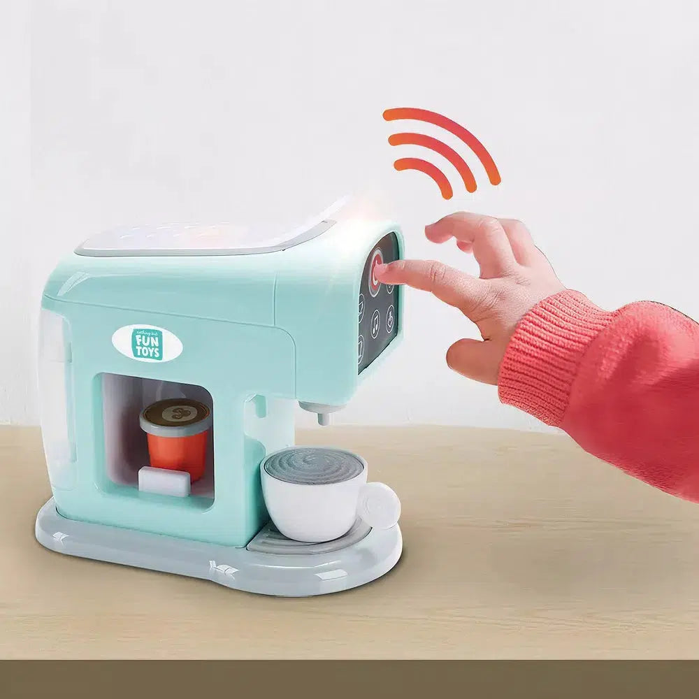 this image shows a child's hand pressing the fake power button to pretend to brew a cup of morning coffee