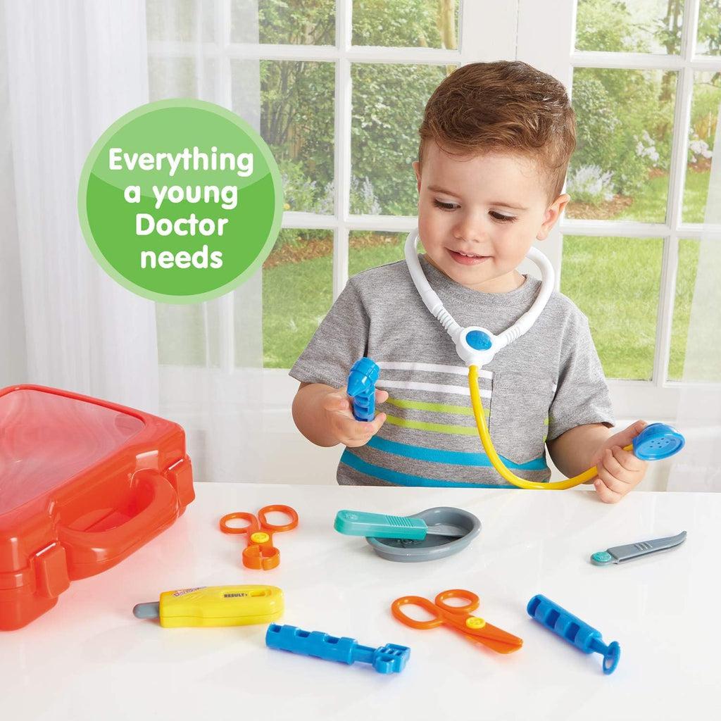 a child has the stethoscope around the neck like a doctor and is smiling while text reads "Everything a young Doctor needs"
