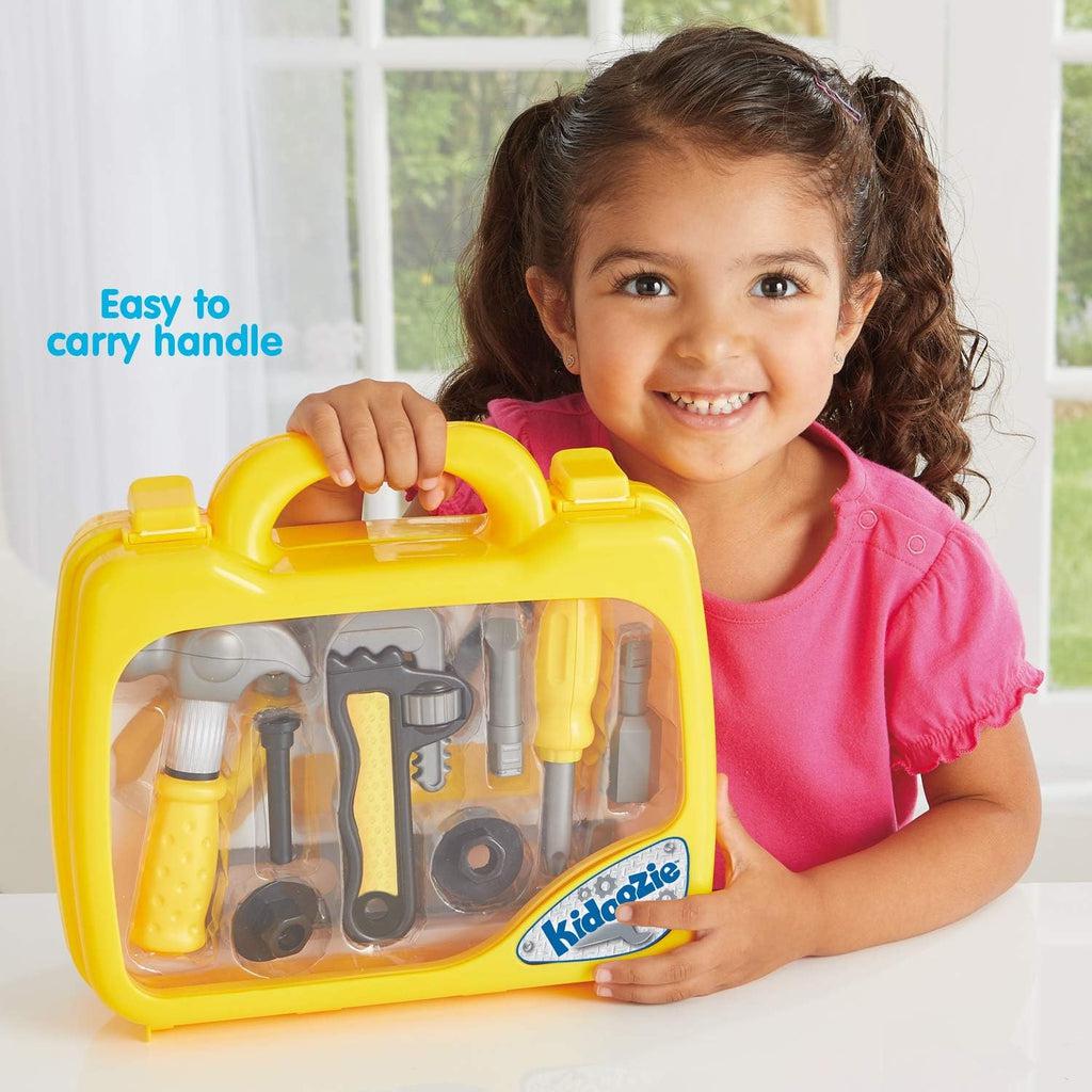 A girl holding the case of the tookbox smiling showing how easy to handle the case is with the tools for kids. 