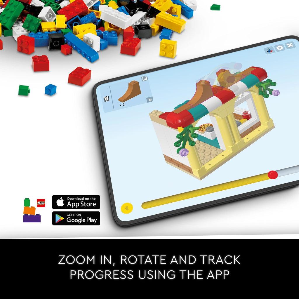 tablet with the lego build app open showing building instructions from a random lego set | Text reads: zoom in, rotate, and track progress using the app